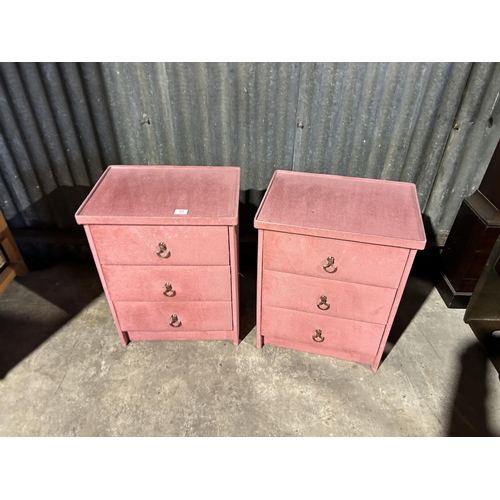 33 - A pair of pink three drawer bedside chests