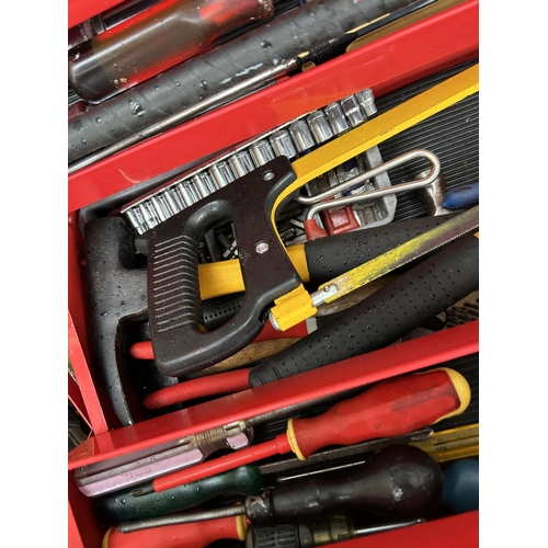 333 - A red task master tool box loaded with assorted tools, saw, wrenches etc