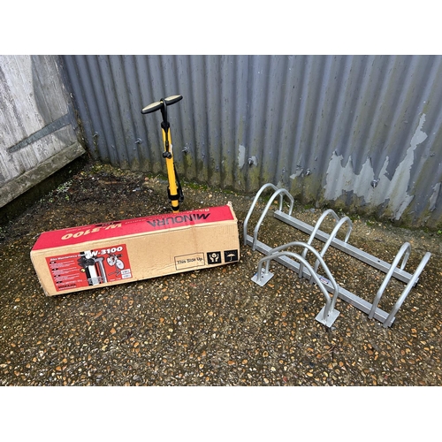 337 - A minoura cycle work station stand, two Sealey cycle racks, and a joe blow cycle pump