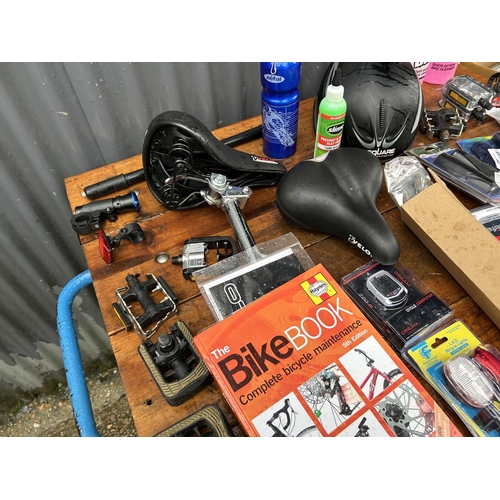 349 - A collection of cycling items including helmet, cleaners, pedals, lights etc