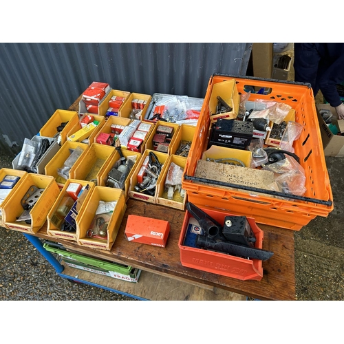 350 - Two crates containing parts, tubs of vintage car parts including dials, lucas bulbs, clips etc