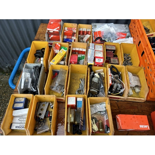 350 - Two crates containing parts, tubs of vintage car parts including dials, lucas bulbs, clips etc