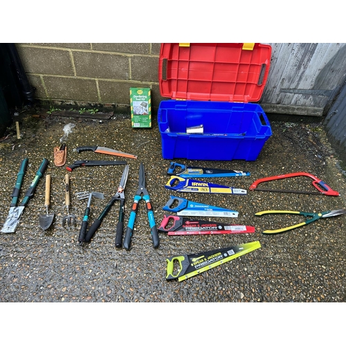 363 - A large blue tub containing new saws, new garden shears and other garden hand tools