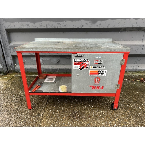 378 - A large metal trolley workbench with single door cupboard