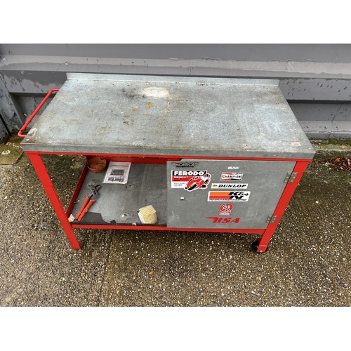 378 - A large metal trolley workbench with single door cupboard