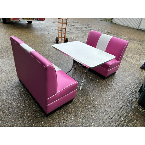 91 - An American diner style ali framed dining table with sparkle top together with two pink and white le... 
