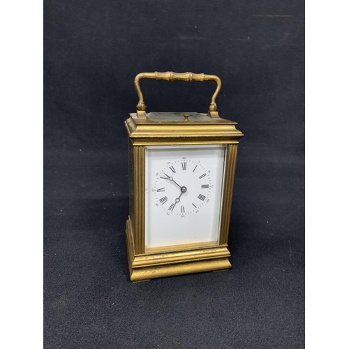 459 - Antique brass carriage clock with striking repeater movement, runs, chip to one side glass, height o... 