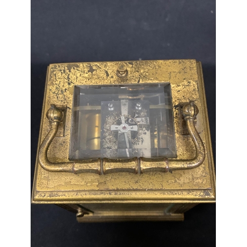 459 - Antique brass carriage clock with striking repeater movement, runs, chip to one side glass, height o... 