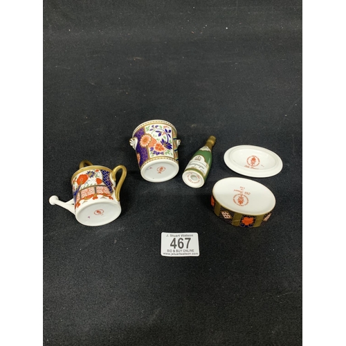 467 - Four Royal Crown Derby Miniatures: Champagne Bottle, Water Can, Jardiniere and Lidded Box (repair to... 