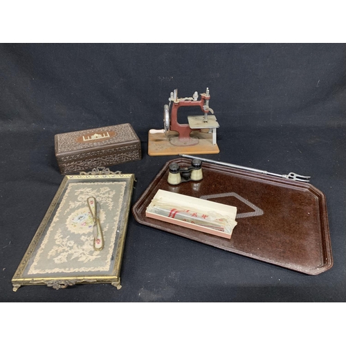 552 - Bakelite tray, miniature sewing machine, dressing table tray, carved box, binoculars and harmonica