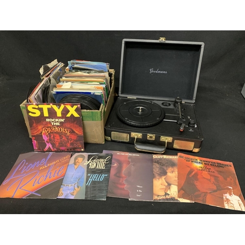 557 - Box of 7inch single records 1970's and 80's and portable record player in case