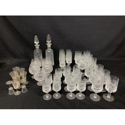 638 - 2 cut glass Decanters and 28 matching drinking glasses, 5 brandy goblets and small glasses