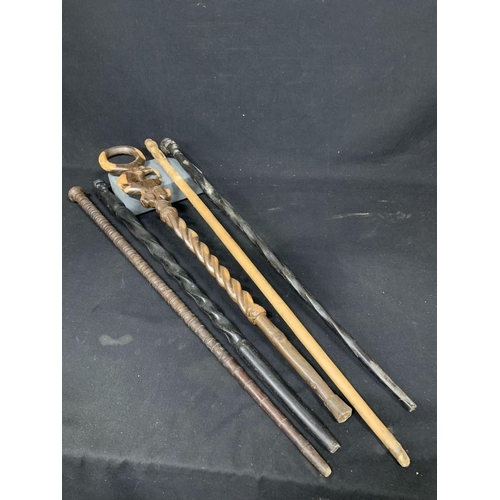 671 - 5 African carved hardwood sticks