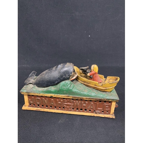 701 - Cast Iron Jonah and the whale money box 24 x 8 cms