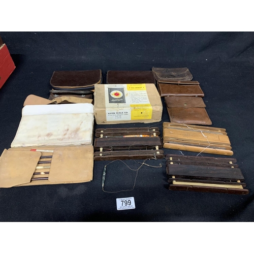 799 - Vintage fishing wallets, winders and scale