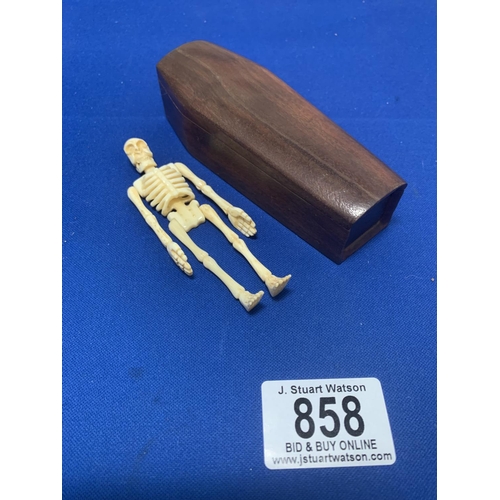 858 - Wooden Coffin contaning miniature bone human skeleton model, length 12 cms