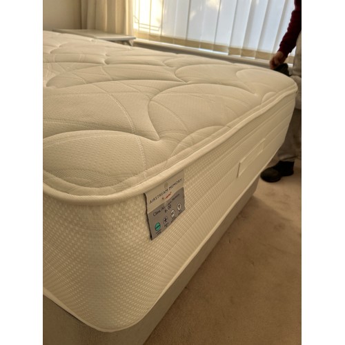 267 - A modern 4ft Small double divan bed with mattress by HARRISION SPINKS with grey upholstered padded h... 