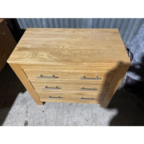 145 - A modern light oak chest of three drawers 86x45x78