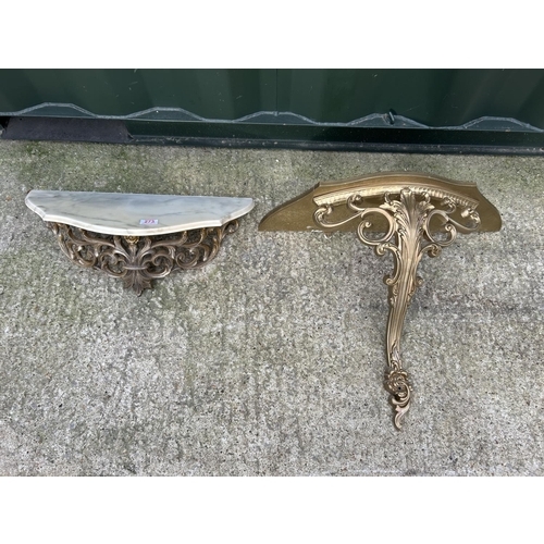 273 - A gold gilt wall mounted console table with marble top together with another gold gilt wall mounted ... 