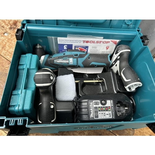 340 - A cased Makita Cordless drill and driver set with charger (lacking batteries)