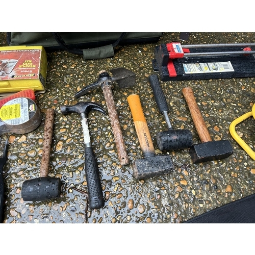 356 - A green and black tool bag together with assorted hammers, drill set, and other tools