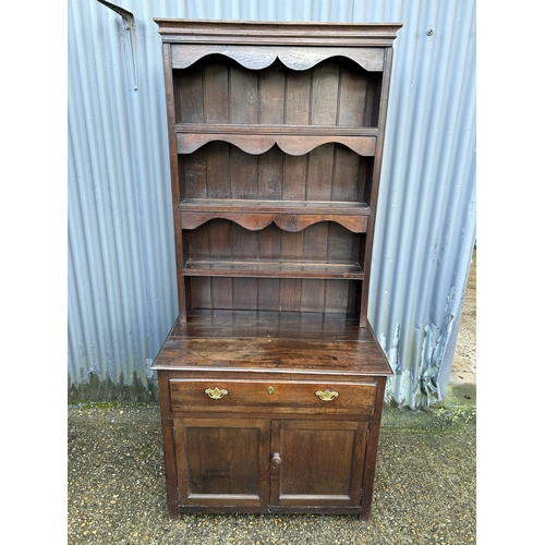 280 - An antique oak dresser with platerack top over single drawer base 90x51x190