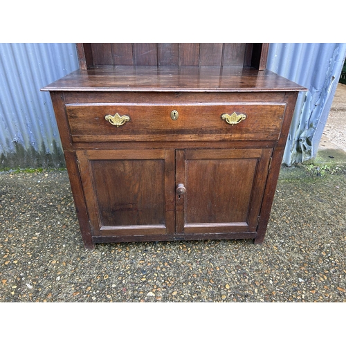 280 - An antique oak dresser with platerack top over single drawer base 90x51x190