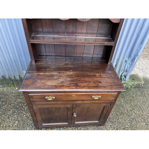 280 - An antique oak dresser with platerack top over single drawer base 90x51x190