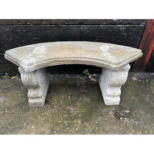 303 - A regal style curved concrete garden bench seat