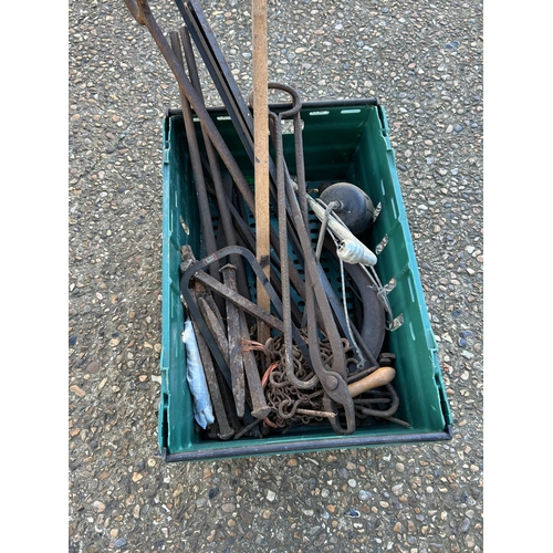 111 - A crate of blacksmith tongs, metal pins etc