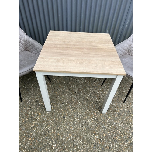 132 - A modern dining table and two chairs 80x80x75