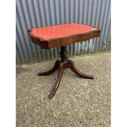 137 - A reproduction mahogany single pedestal centre table with red leather top 71x56x72