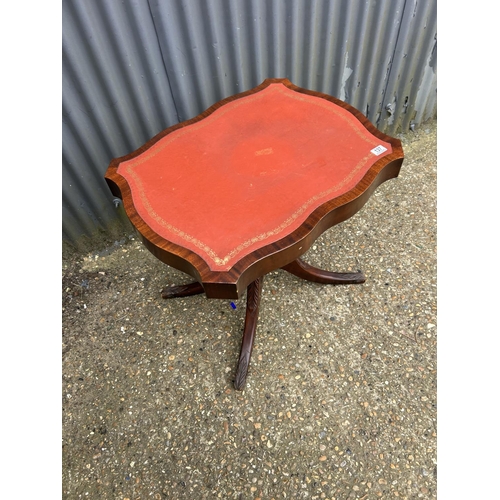 137 - A reproduction mahogany single pedestal centre table with red leather top 71x56x72