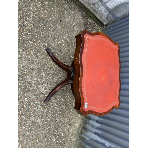 137 - A reproduction mahogany single pedestal centre table with red leather top 71x56x72