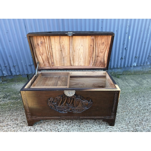 14 - A carved Camphor wood dome top blanket box 103x50x60