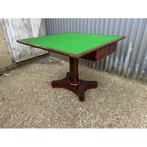 144 - A Victorian mahogany card table with fold over top