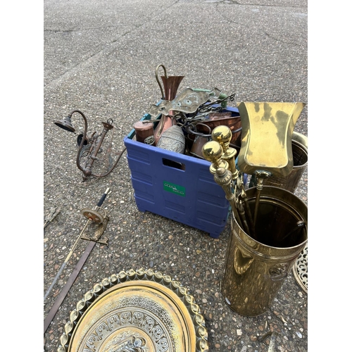 149 - A large collection of brass and copperware including small brass table, fire dogs, stick stand, tray... 