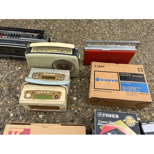 150 - A collection of vintage radios, cassette players and disc player