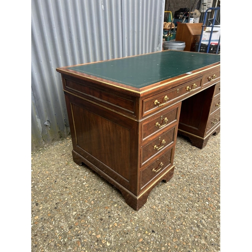 180 - A French empire mahogany twin pedestal desk with green leather top 136x76x75
