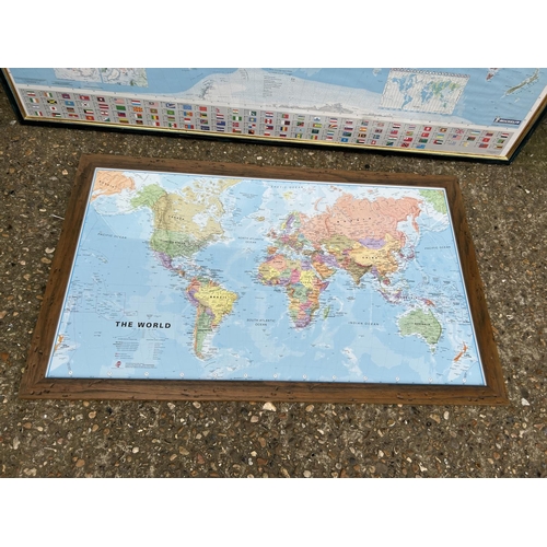 191 - Two very large framed and glazed maps of the world - larger measures 150x105