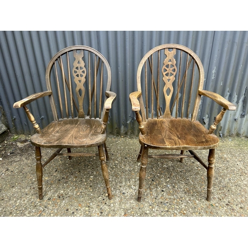 200 - A pair of wheelback carver chairs