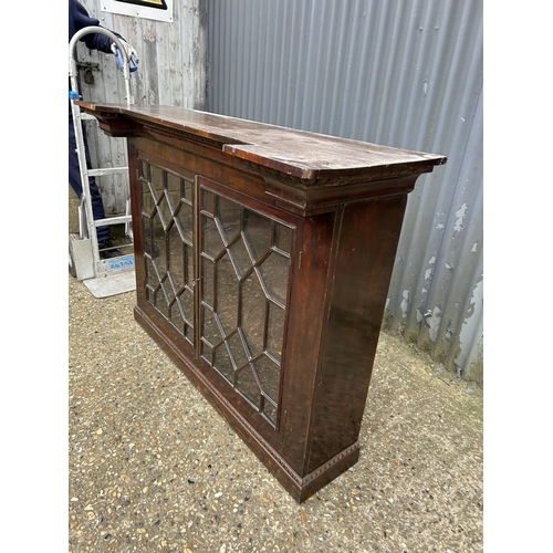 203 - A mahogany glazed two door cabinet138x43x100