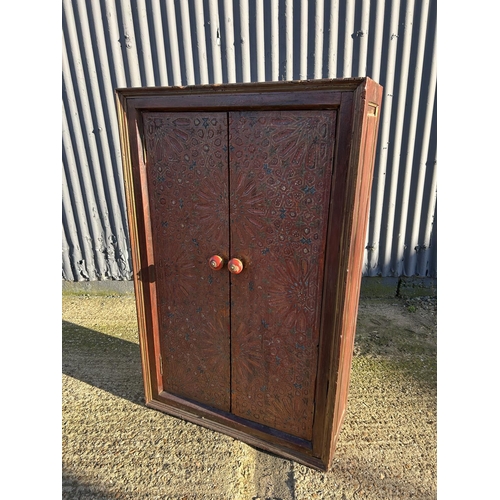 22 - A  Flemish red and gold painted two door cupboard 76x30x120