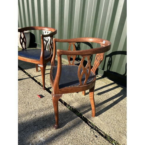 247 - A pair of Edwardian mahogany tub shaped chairs