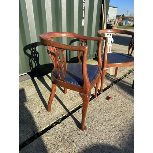 247 - A pair of Edwardian mahogany tub shaped chairs