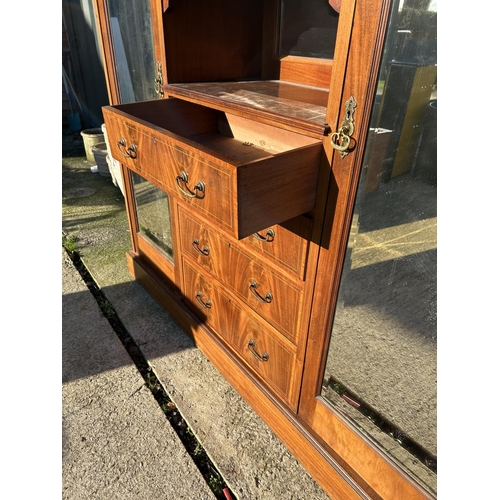 248 - A Edwardian mahogany inlaid triple compactum wardrobe with central linen cupboard and four drawers f... 