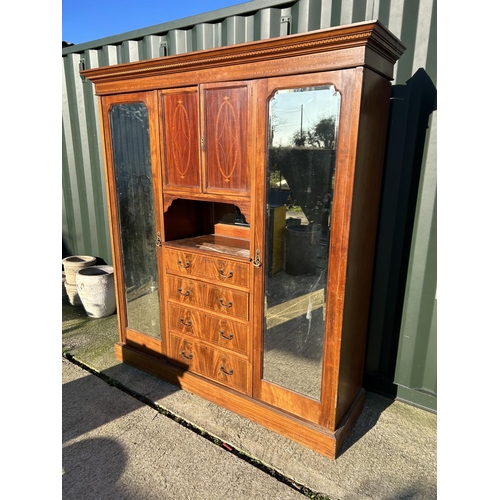 248 - A Edwardian mahogany inlaid triple compactum wardrobe with central linen cupboard and four drawers f... 