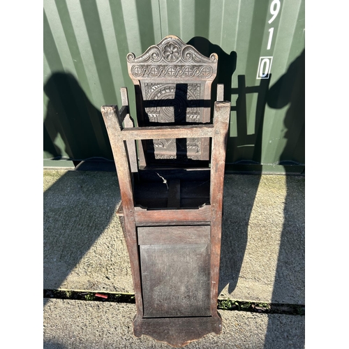 250 - A pair of antique oak chairs with carved panel backs