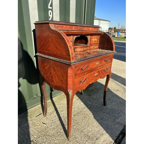 251 - A continental inlaid cylinder top ladies writing table with gilt mounts 76x50x104