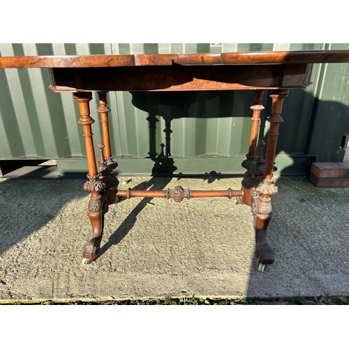 254 - A Victorian walnut fold over card table